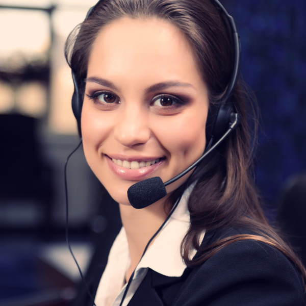 Smiling female customer service support representative wearing a headset