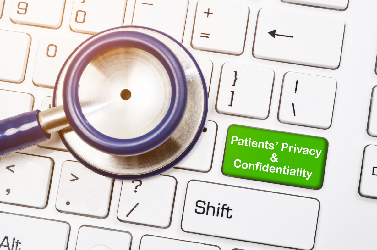 Stethoscope with written Patients' privacy and confidentiality on coumputer keyboard.