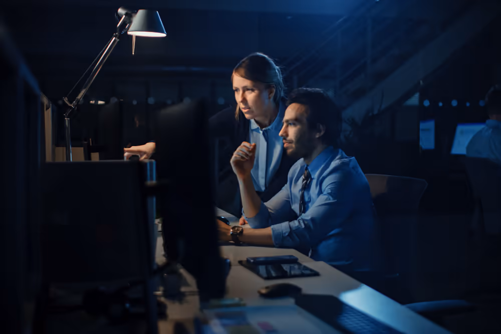 Ambitious and confident businessman uses desktop computer